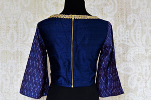 Dark blue raw silk embroidered saree blouse for online shopping in USA. Pure Elegance clothing store brings an exquisite range of Indian sari blouses in USA for women.-back