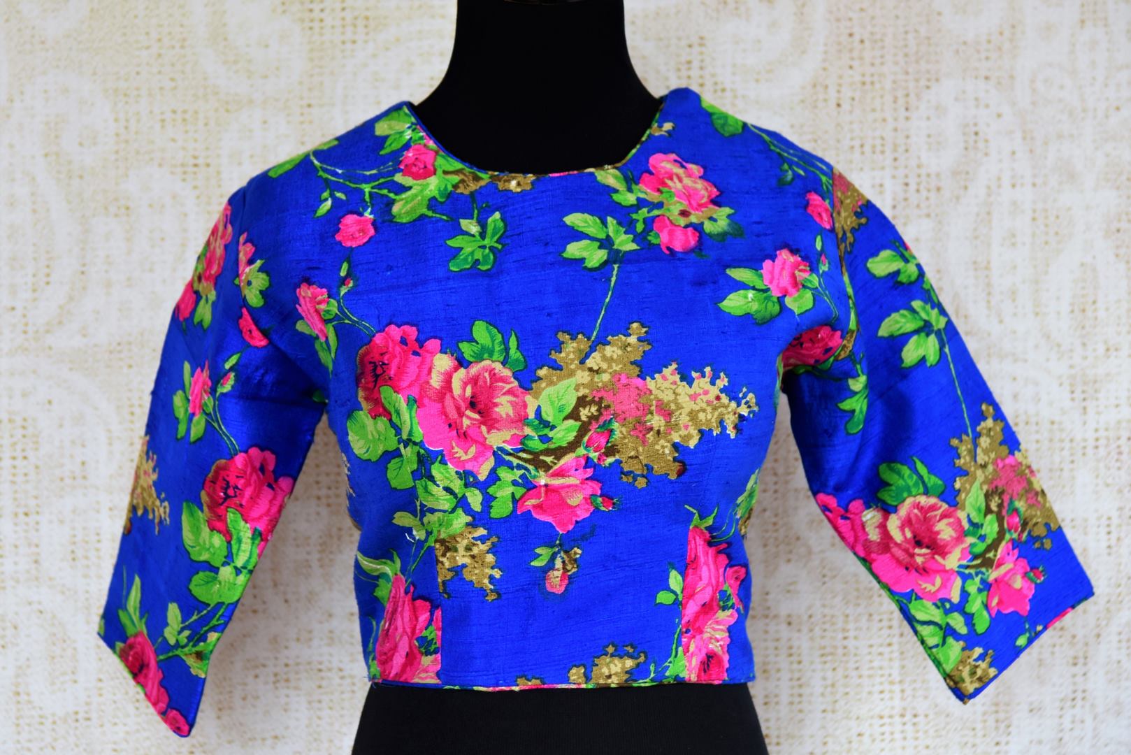 Buy blue floral print raw silk saree blouse online in USA. Pure Elegance clothing store brings an exquisite range of Indian designer sari blouses in USA for women.  -front