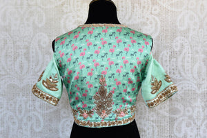 Green printed embroidered cold shoulder sari blouse buy online in USA. For an elegant Indian style, choose readymade saree blouses at Pure Elegance online store.-back