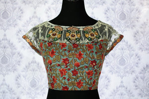 Buy green printed designer sari blouse with embroidery online in USA. Pure Elegance Indian clothing store brings an exquisite range of designer blouses in USA to match your gorgeous Indian sarees. Add spark to your traditional look with elegant saree blouses at every occasion.-front