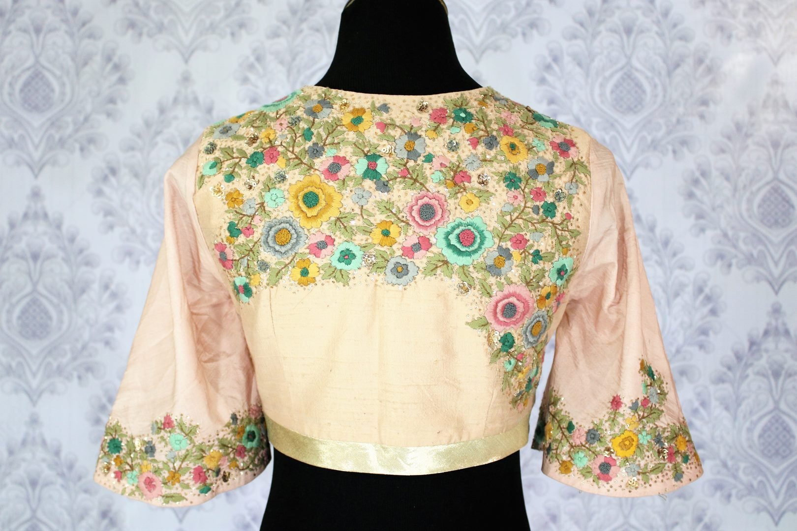 Buy peach saree blouse with embroidery online in USA. Pure Elegance Indian clothing store brings an exquisite range of designer blouses in USA to match your gorgeous Indian sarees. Add spark to your ethnic look with stylish saree blouses for every occasion.-back