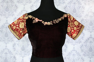 Buy maroon embroidered velvet sari blouse online in USA. Pure Elegance Indian clothing store brings an exquisite range of readymade saree blouses in USA to match your gorgeous Indian saris. Add spark to your ethnic look with stylish saree blouses for weddings and parties.-front