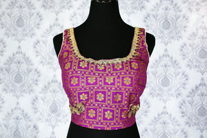 Buy purple embroidered sleeveless saree blouse online in USA. Pure Elegance Indian clothing store brings an exquisite range of readymade saree blouses in USA to match your gorgeous Indian saris. Add spark to your ethnic look with stylish sari blouses for weddings and parties.-front