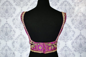 Buy purple embroidered sleeveless saree blouse online in USA. Pure Elegance Indian clothing store brings an exquisite range of readymade saree blouses in USA to match your gorgeous Indian saris. Add spark to your ethnic look with stylish sari blouses for weddings and parties.-back