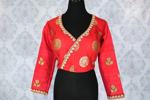Buy ethnic red embroidered Banarasi saree blouse online in USA. Pure Elegance Indian clothing store brings an exquisite range of readymade saree blouses in USA to match your gorgeous Indian sarees. Elevate your ethnic look with stylish Indian sari blouses for weddings and parties.-front