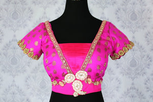 Buy ethnic pink embroidered designer saree blouse with buta online in USA. Pure Elegance Indian clothing store brings an exquisite range of readymade sari blouses in USA to match your gorgeous Indian sarees. Glam up your ethnic look with stylish Indian sari blouses for weddings and parties.-front