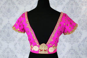 Buy ethnic pink embroidered designer saree blouse with buta online in USA. Pure Elegance Indian clothing store brings an exquisite range of readymade sari blouses in USA to match your gorgeous Indian sarees. Glam up your ethnic look with stylish Indian sari blouses for weddings and parties.-back