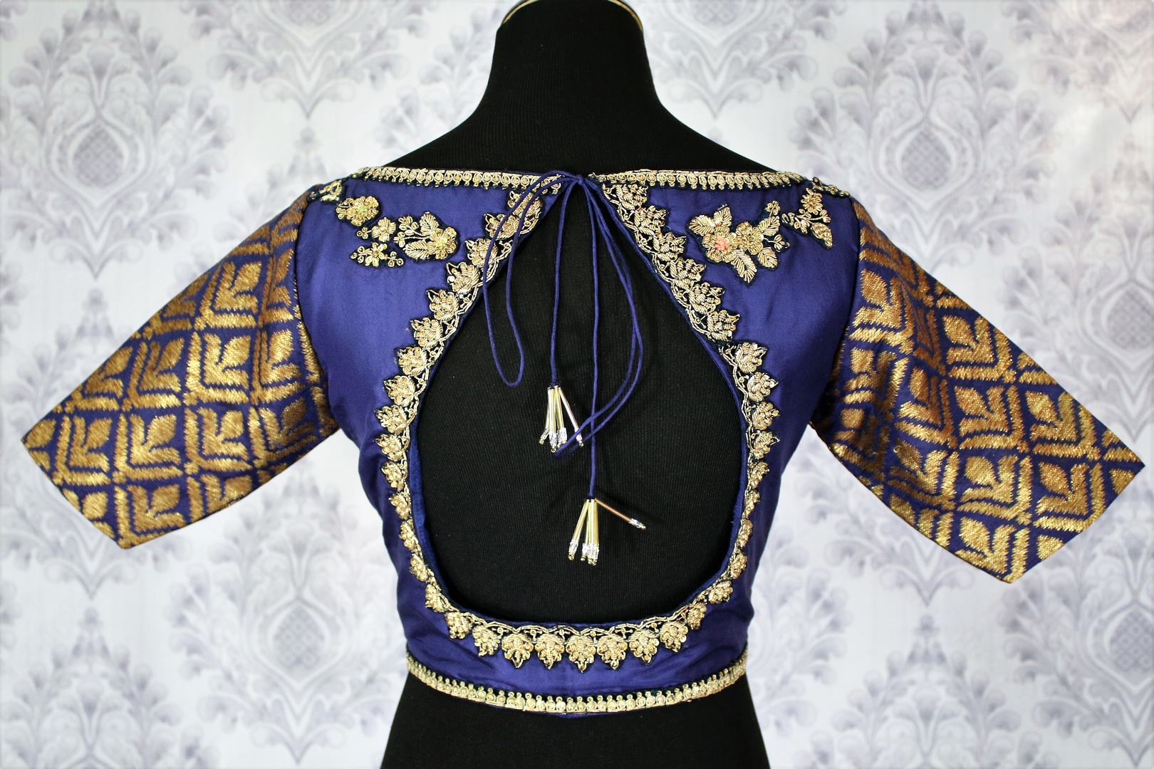 Buy beautiful royal blue embroidered designer sari blouse online in USA. Pure Elegance Indian fashion store brings an exclusively curated range of readymade saree blouses in USA to match your gorgeous Indian saris. Glam up your Indian look with stylish Indian saree blouses for weddings and parties.-back