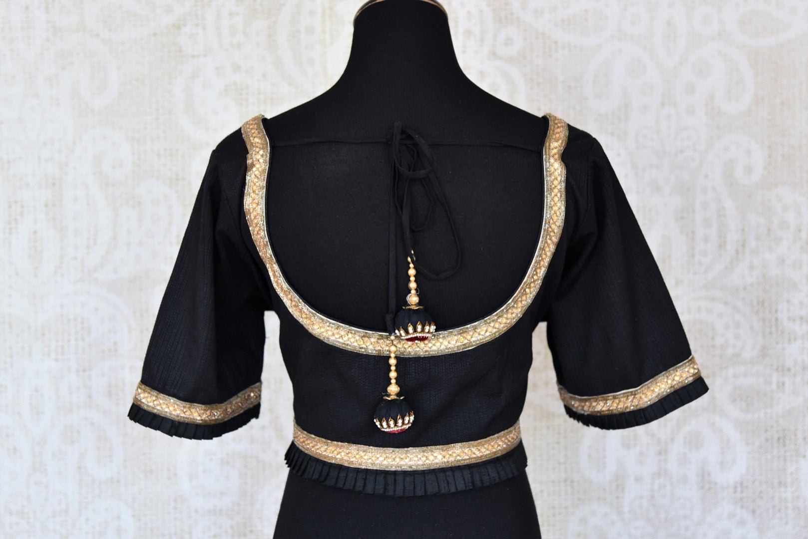 Shop black embroidered cotton designer saree blouse online in USA. Elevate your traditional Indian sarees with matching and contrasting readymade saree blouses from Pure Elegance Indian clothing store in USA.-back