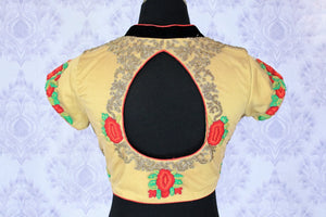 Up your fashion appeal in this aesthetically pleasing beige floral embroidered designer blouse. The melange of red and green floral hues with a keyhole at back creates quite a stunning look. Shop such beautiful blouses online or visit Pure Elegance store in USA.-back