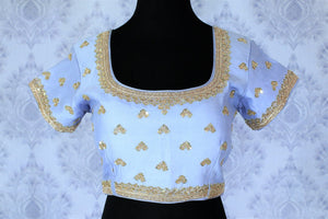 This celebrity-inspired powder blue coloured pastel blouse with stunning gold embroidery is quite a tempting bait. The wide keyhole with tassels hanging at the back further create drama and add grace to the feminine look. Shop beautifully handcrafted blouses online or visit Pure Elegance store in USA.-front