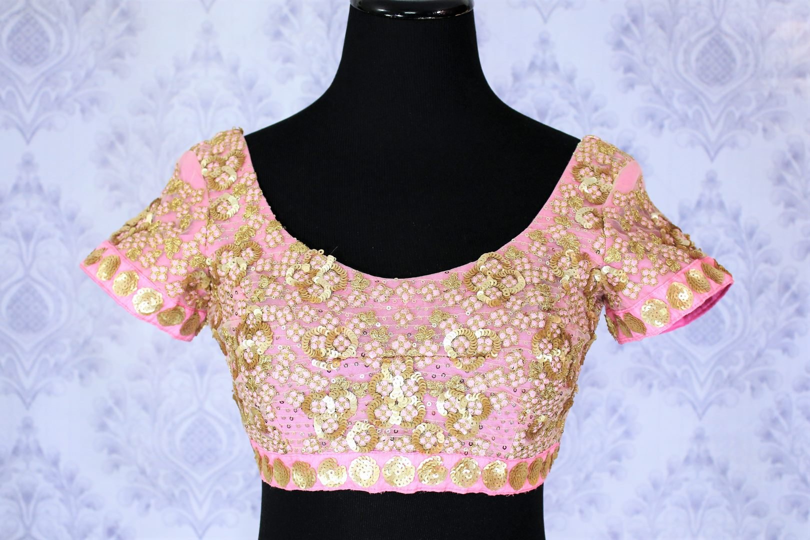 Up your ante in this uber-fancy pink sequin work designer blouse. The intricately embroidered pink blouse is sure to sizzle your outfit. Take this head turner sari blouse to weddings or parties. Shop such scintillating designer blouses online or visit Pure Elegance store in USA. -front