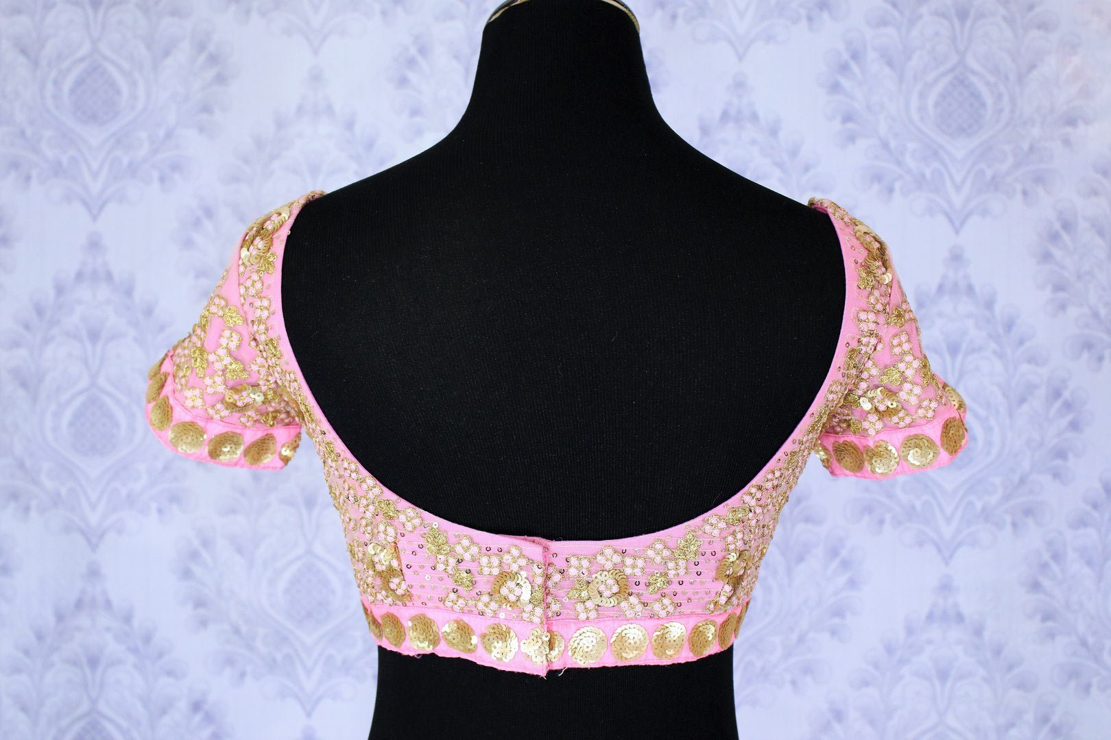 Up your ante in this uber-fancy pink sequin work designer blouse. The intricately embroidered pink blouse is sure to sizzle your outfit. Take this head turner sari blouse to weddings or parties. Shop such scintillating designer blouses online or visit Pure Elegance store in USA. -back