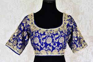 Buy beautiful blue Banarasi embroidered readymade saree blouse online in USA. Match your saree with exquisite designer saree blouses from Pure Elegance clothing store in USA. Shop now at our store or visit online.-front