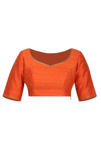 Buy orange raw silk saree blouse online in USA with hand embroidery. Match your designer sarees with stylish readymade sari blouses available at Pure Elegance clothing store in USA or shop online.-front
