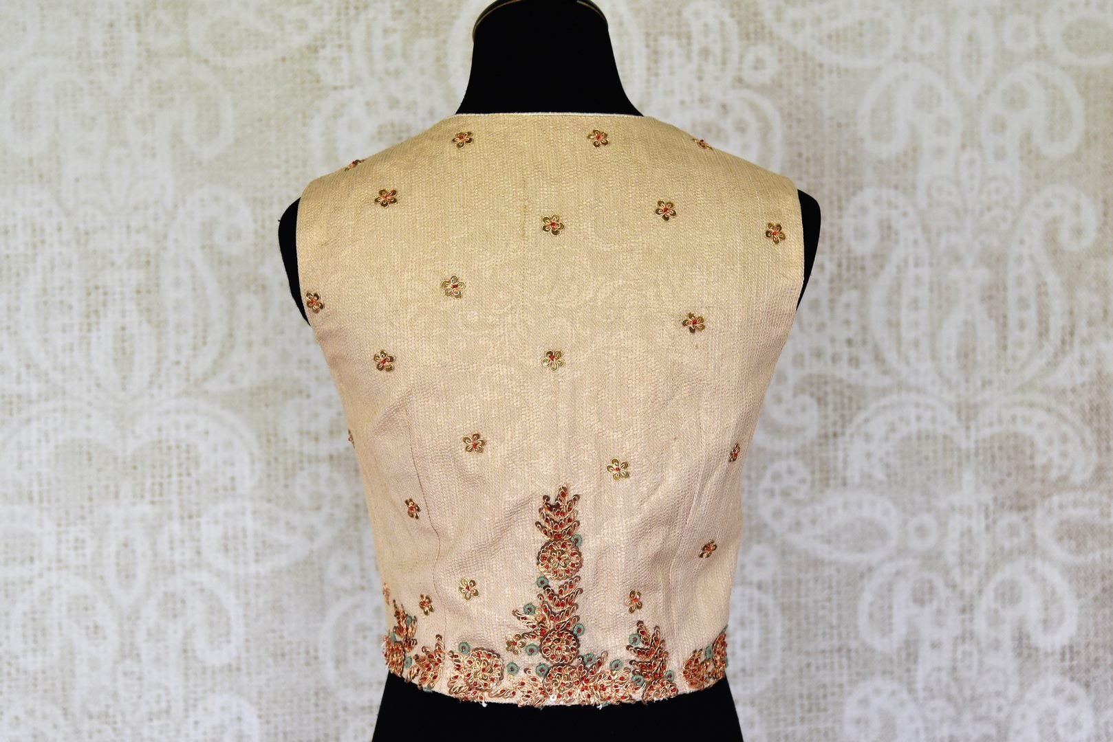 Shop cream color embroidered sleeveless silk saree blouse online in USA. For Indian women in USA, Pure Elegance fashion store brings an alluring collection of designer sarees blouses to match your beautiful Indian saris. Shop now at our online store.-back