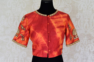 Buy bright red and orange embroidered silk saree blouse online in USA, Elevate your saree style with a stunning variety of designer saree blouses from Pure Elegance Indian clothing store in USA, Shop now.-front