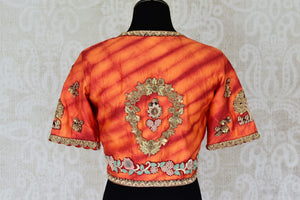 Buy bright red and orange embroidered silk saree blouse online in USA, Elevate your saree style with a stunning variety of designer saree blouses from Pure Elegance Indian clothing store in USA, Shop now.-back