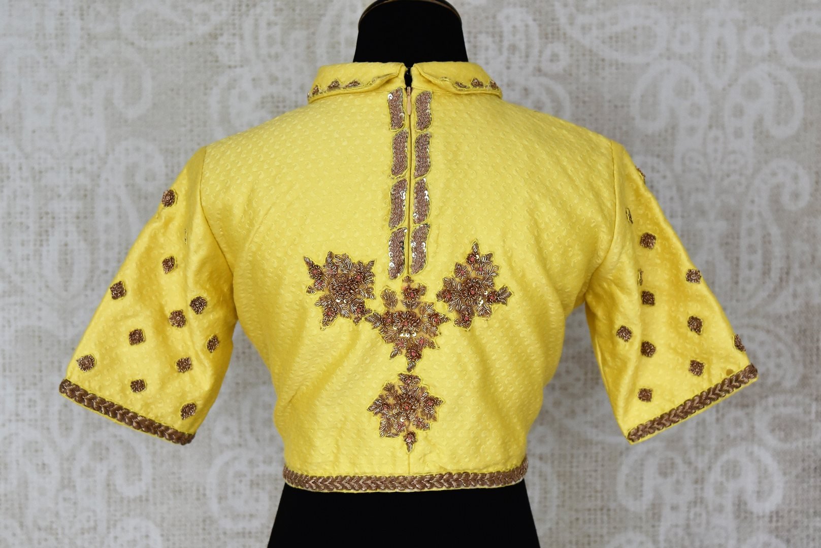 Shop bright yellow embroidered silk designer sari blouse online in USA. Elevate your traditional Indian sarees with matching and contrasting readymade saree blouses from Pure Elegance Indian clothing store in USA.-back
