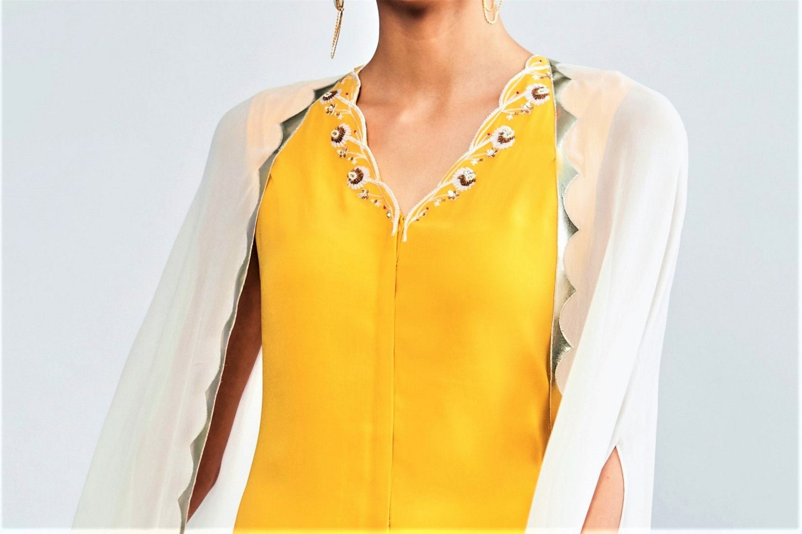 Buy yellow georgette kurta with cape online in USA and sharara pants. Shop exclusive Indian designer saris, party sarees, wedding dresses in USA at Pure Elegance clothing store. Explore a range of traditional Indian women clothing also available at our online store. Shop now.-kurta