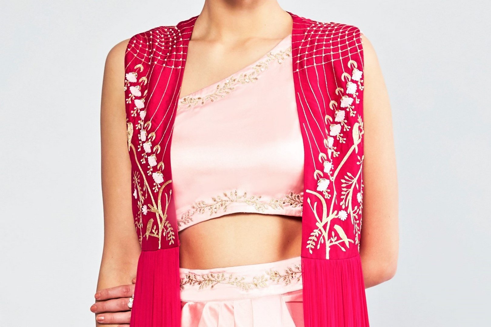 Shop blush pink embroidered top with drape skirt and cape online in USA. Shop exclusive Indian designer saris, party dresses, wedding dresses in USA at Pure Elegance clothing store. Explore a range of traditional Indian women clothing also available at our online store. Shop now.-top