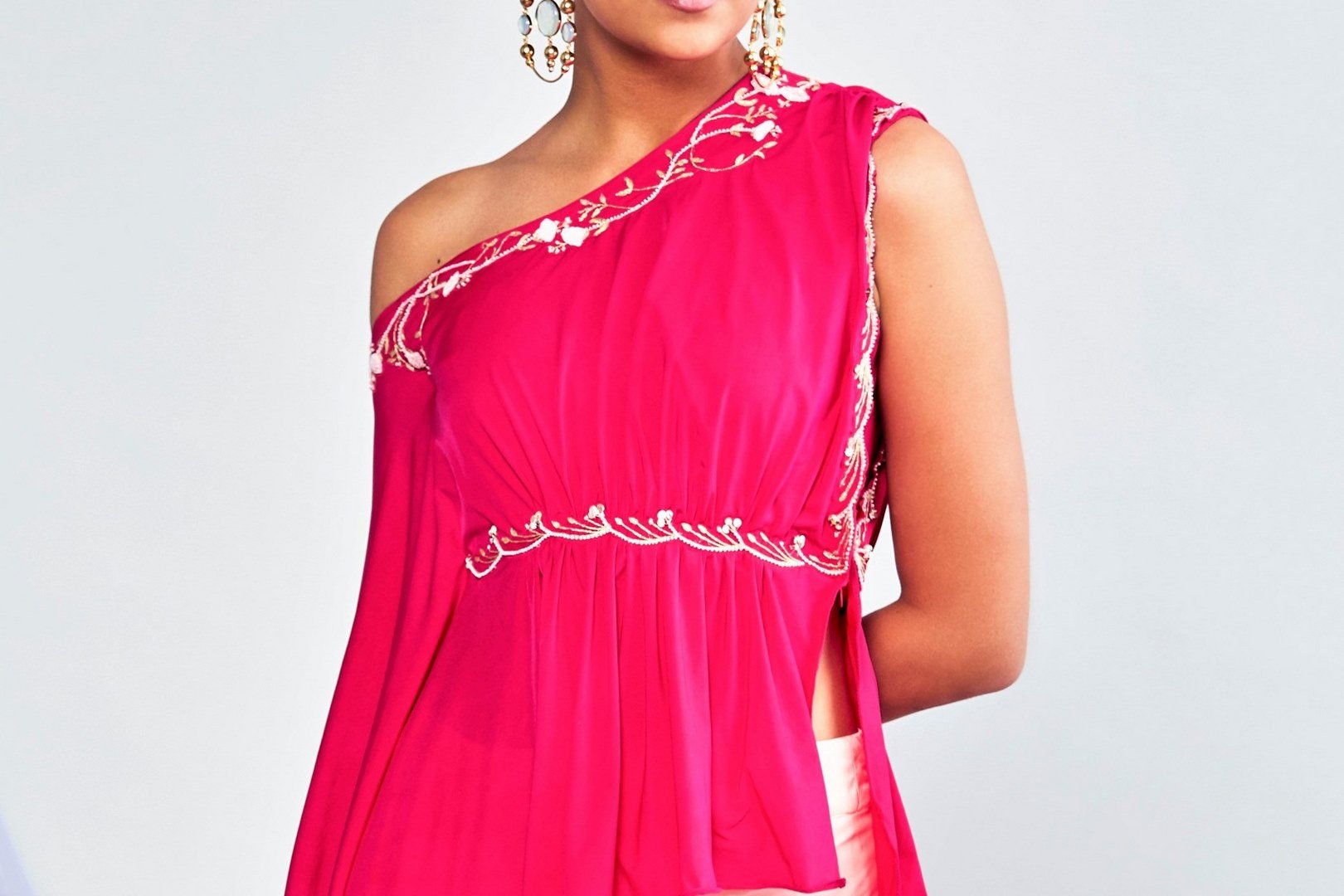 Buy pink one-shoulder embroidered top with drape skirt online in USA. Shop exclusive Indian designer saris, party dresses, wedding dresses in USA at Pure Elegance clothing store. Explore a range of traditional Indian women clothing also available at our online store. Shop now.-top