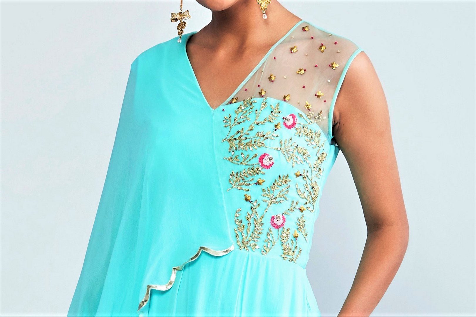 Buy turquoise blue embroidered georgette jumpsuit online in USA with attached drape. Elevate your Indian style with a range of exclusive Indian designer dresses from Pure Elegance clothing store in USA. We have an exquisite collection of Indian sarees, suits, Anarkalis, lehengas for Indian women living in USA. Shop now.-top