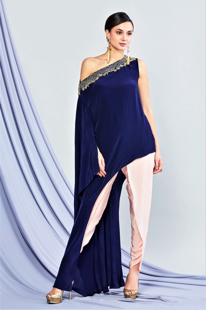 Shop navy blue asymmetric top with blush pink pants online in USA. Elevate your Indian style with a range of exclusive Indian designer dresses from Pure Elegance clothing store in USA. We have an exquisite collection of Indian sarees, suits, Anarkalis, lehengas for Indian women living in USA. Shop now.-full view