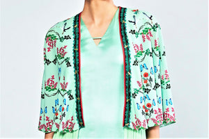 Shop sea green draped dress with printed cape jacket online in USA. Elevate your Indian style with a range of exclusive Indian designer dresses from Pure Elegance clothing store in USA. We have an exquisite collection of Indian saris, suits, Anarkalis, lehengas for Indian women living in USA. Shop now.-top
