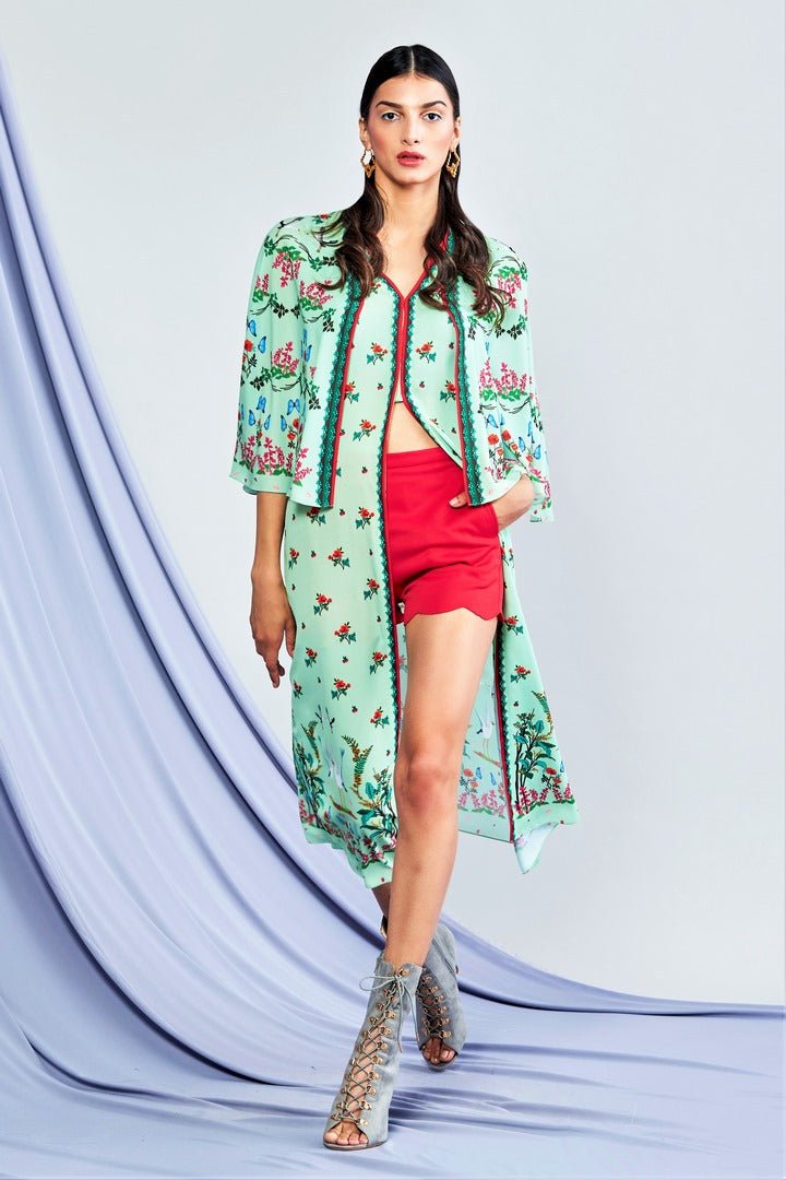 Shop sea green printed long top with printed cape jacket online in USA and red shorts. Elevate your Indian style with a range of exclusive Indian designer dresses from Pure Elegance clothing store in USA. We have an exquisite collection of Indian saris, suits, Anarkalis, lehengas for Indian women living in USA. Shop now.-full view