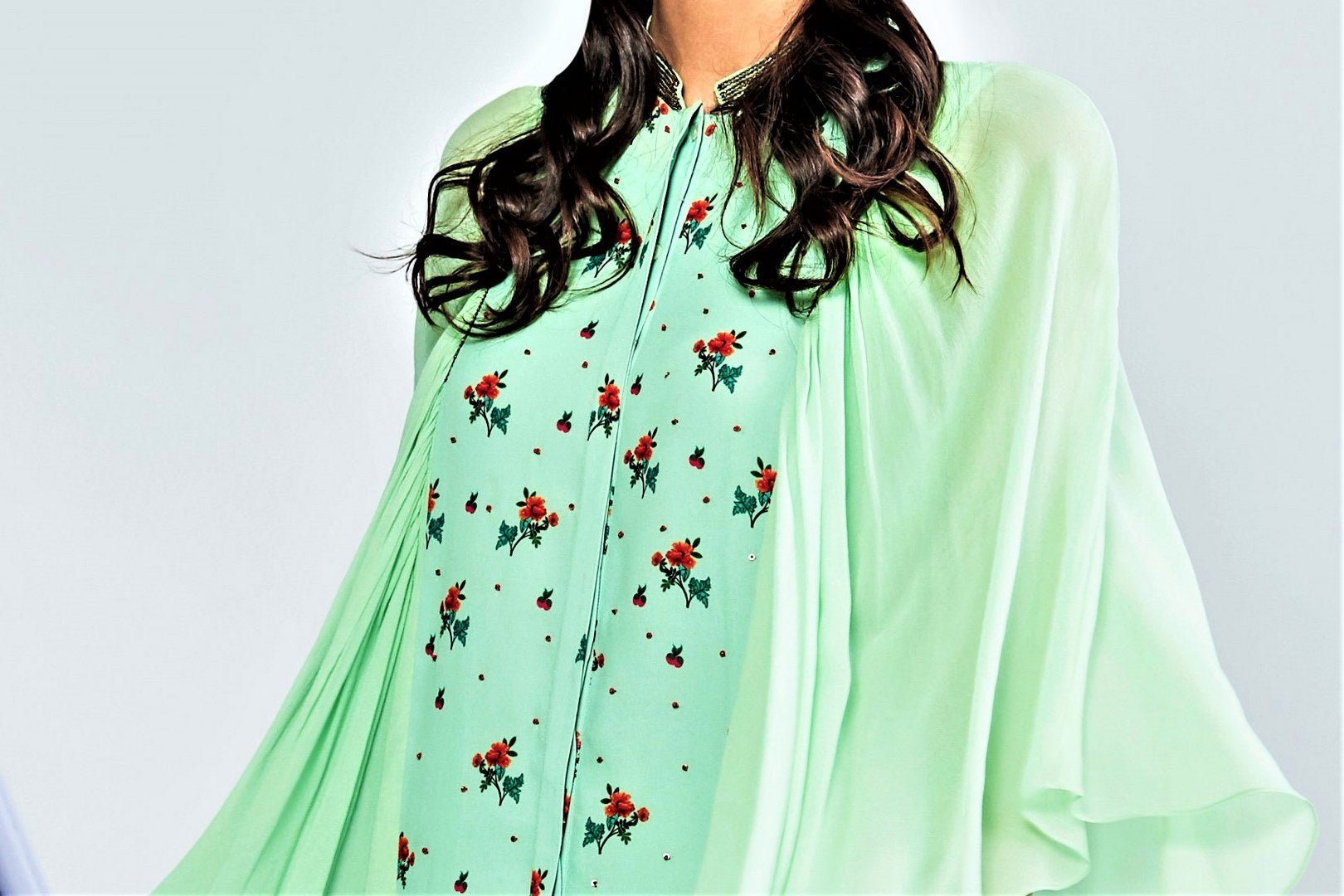 Shop sea green printed top with winged sleeves and pants online in USA. Elevate your Indian style with a range of exclusive Indian designer dresses from Pure Elegance clothing store in USA. We have an exquisite collection of Indian saris, suits, Anarkalis, lehengas for Indian women living in USA. Shop now.-top
