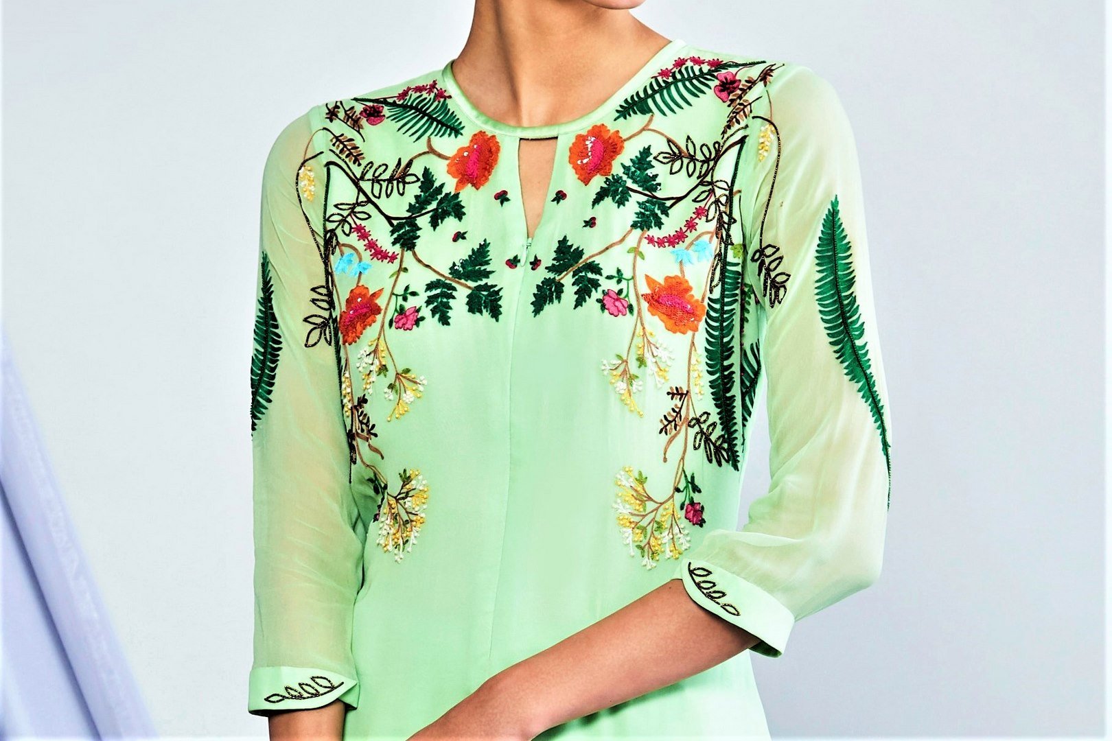 Shop sea green embroidered high low kurta with pants online in USA. Elevate your Indian style with a range of exclusive Indian designer dresses from Pure Elegance clothing store in USA. We have an exquisite collection of Indian saris, suits, Anarkalis, lehengas for Indian women living in USA. Shop now.-top
