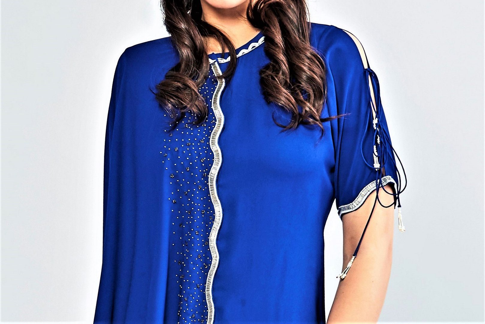 Shop ink blue embroidered aymmetric top with pants online in USA. Elevate your Indian style with a range of exclusive Indian designer outfits from Pure Elegance clothing store in USA. We have an exquisite collection of Indian sarees, suits, Anarkalis, lehengas for Indian women living in USA. Shop now. -top
