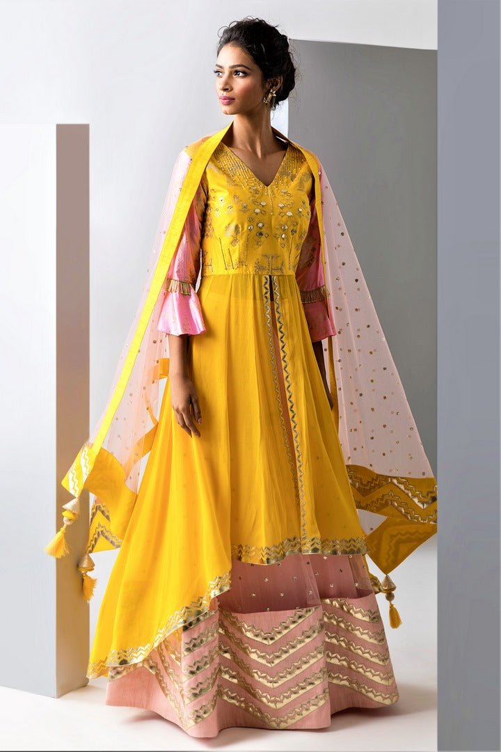 Buy yellow embroidered asymmetric kurta with pink palazzo online in USA and dupatta. Make a dazzling style statement at parties, weddings and festive occasions with a range of exquisite designer dresses, designer gowns, wedding lehengas available at Pure Elegance Indian clothing store in USA or on our online store.-side