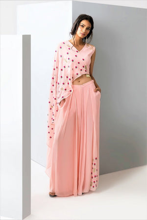 Shop pink embroidered crop top with drape online in USA and palazzo. Make a dazzling style statement at parties, weddings and festive occasions with a range of exquisite designer dresses, designer gowns, wedding lehengas available at Pure Elegance Indian clothing store in USA or on our online store.-front