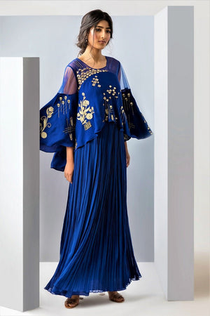 Shop beautiful blue embroidered and layered long dress online in USA. Make a dazzling style statement at parties, weddings and festive occasions with a range of exquisite designer dresses, designer gowns, wedding lehengas available at Pure Elegance Indian clothing store in USA or on our online store.-side