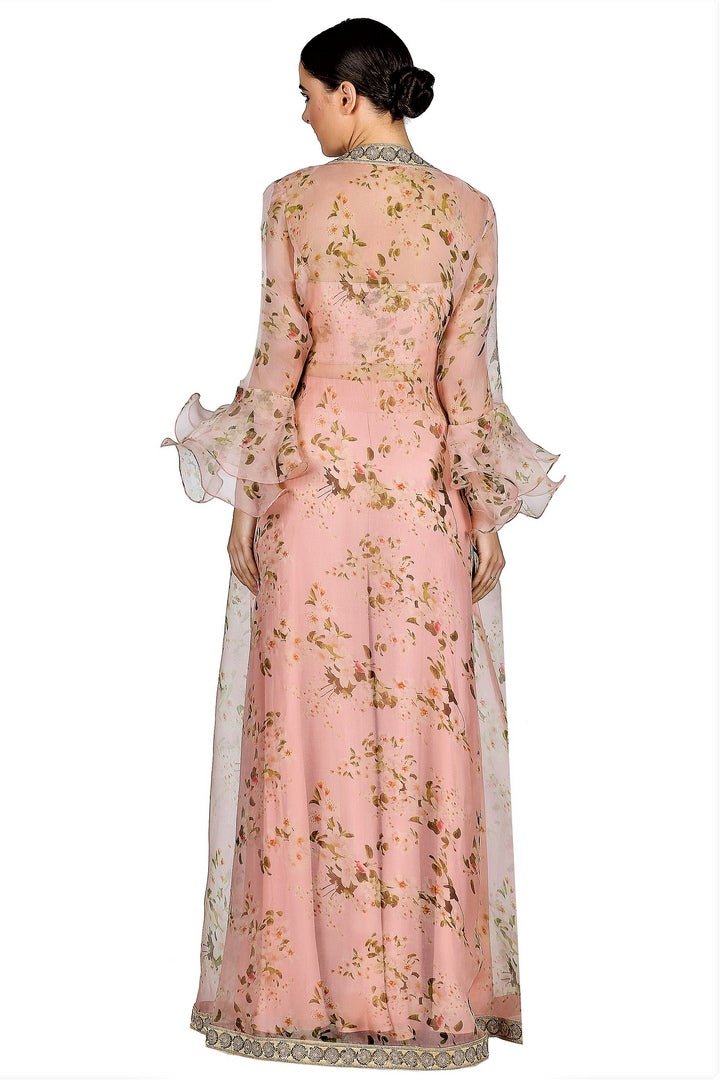 Buy light peach blouse with sharara online in USA and floral print cape. Give your wardrobe an exquisite variety of designer dresses, designer gowns, wedding lehengas, Anarkali suits from Pure Elegance Indian clothing store in USA or from our online store.-back