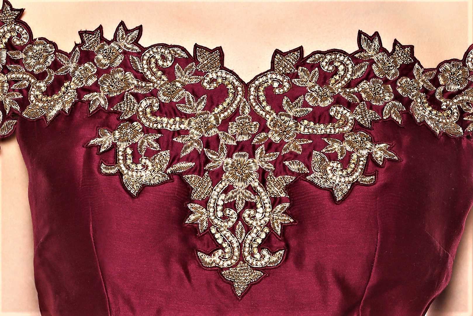 Buy wine color embroidered off-shoulder top with skirt online in USA. Give your wardrobe an exquisite variety of designer dresses, designer gowns, wedding lehengas, Anarkali suits from Pure Elegance Indian clothing store in USA or from our online store.-blouse