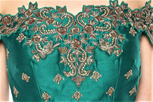 Shop green color embroidered off-shoulder top with skirt online in USA. Give your wardrobe an exquisite variety of designer dresses, designer gowns, wedding lehengas, Anarkali suits from Pure Elegance Indian clothing store in USA or from our online store.-blouse 