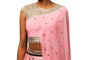Buy beautiful pink embroidered draped blouse with skirt online in USA. Revamp your wardrobe with an exquisite variety of designer dresses, designer gowns, wedding lehengas, Anarkali suits, Indian sarees from Pure Elegance Indian clothing store in USA or from our online store. -blouse