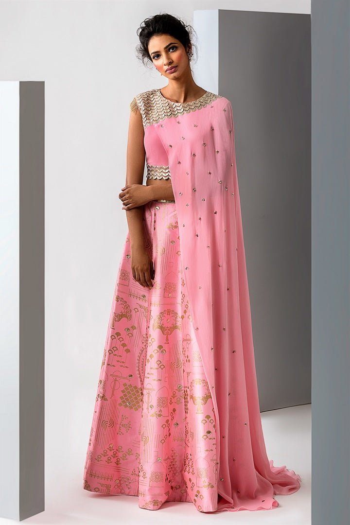Buy beautiful pink embroidered draped blouse with skirt online in USA. Revamp your wardrobe with an exquisite variety of designer dresses, designer gowns, wedding lehengas, Anarkali suits, Indian sarees from Pure Elegance Indian clothing store in USA or from our online store. -front