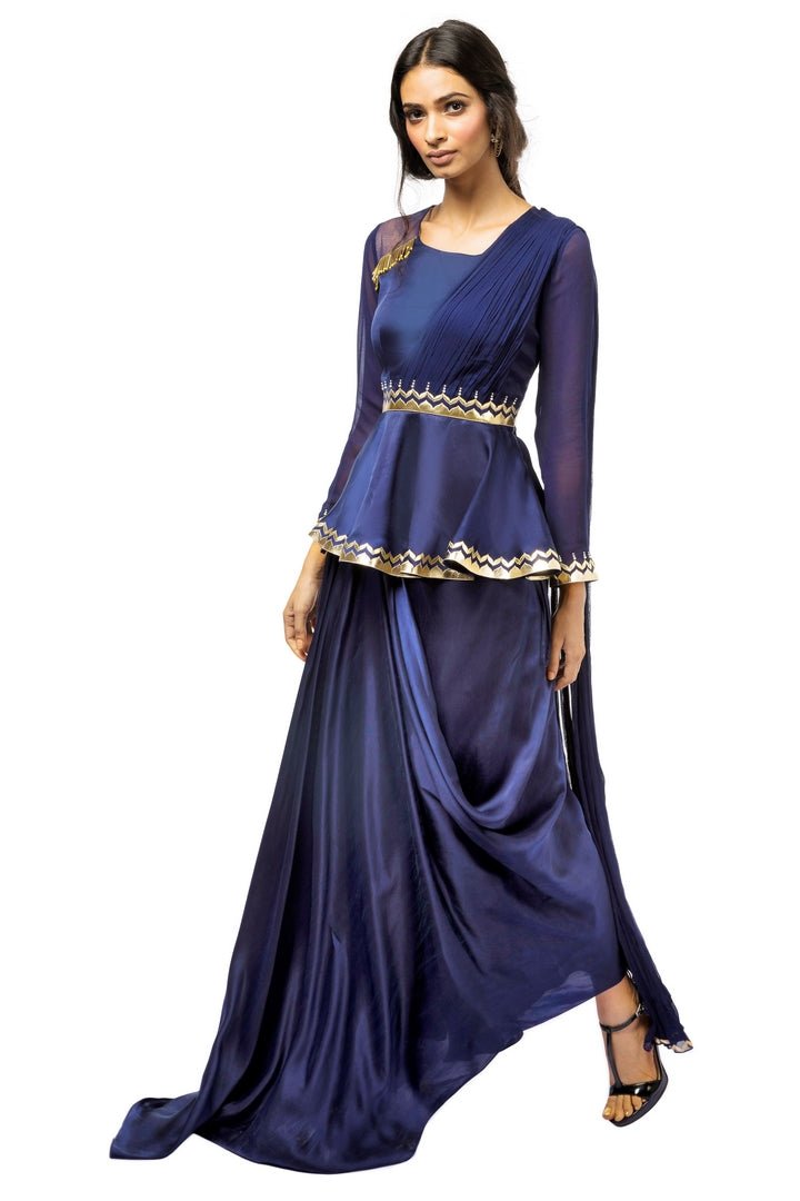 Buy blue embroidered satin peplum blouse with attached drape and dhoti skirt online in USA. Revamp your wardrobe with an exquisite variety of designer dresses, designer gowns, wedding lehengas, Anarkali suits, Indian designer saris from Pure Elegance Indian clothing store in USA or from our online store. -full view