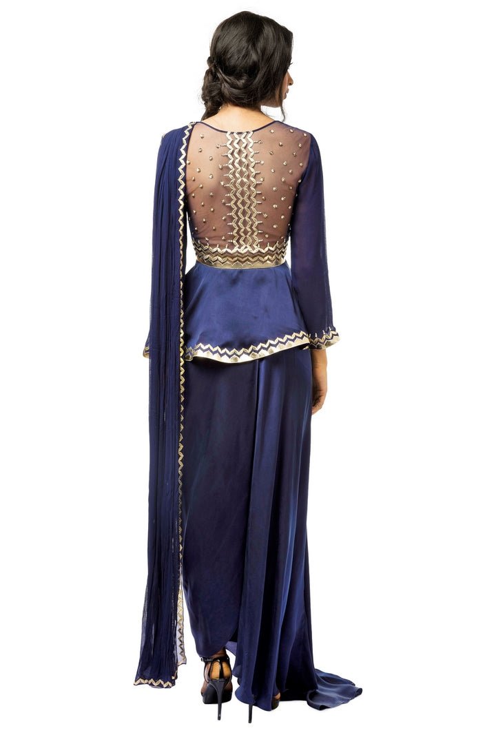 Buy blue embroidered satin peplum blouse with attached drape and dhoti skirt online in USA. Revamp your wardrobe with an exquisite variety of designer dresses, designer gowns, wedding lehengas, Anarkali suits, Indian designer saris from Pure Elegance Indian clothing store in USA or from our online store. -back