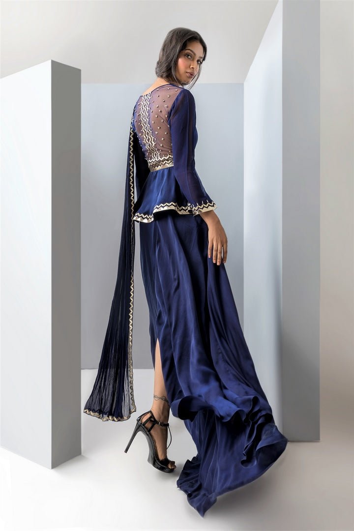 Buy blue embroidered satin peplum blouse with attached drape and dhoti skirt online in USA. Revamp your wardrobe with an exquisite variety of designer dresses, designer gowns, wedding lehengas, Anarkali suits, Indian designer saris from Pure Elegance Indian clothing store in USA or from our online store. -side
