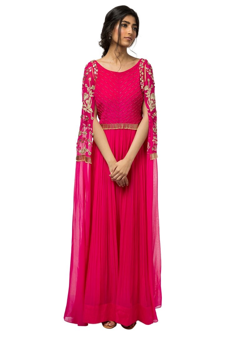 Shop hot pink embroidered georgette gown with embroidered curtain sleeves online in USA. Revamp your wardrobe with an exquisite variety of designer dresses, designer gowns, wedding lehengas, by Abirr N' Nanki available at Pure Elegance Indian clothing store in USA or shop from our online store.-full view