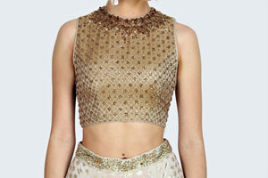 Buy gold brocade embroidered crop top with foil print sharara online in USA. For more such gorgeous designer dresses, shop at Pure Elegance Indian fashion store in USA. A beautiful range of traditional sarees and designer clothing is available for Indian women living in USA. You can also shop at our online store.-top