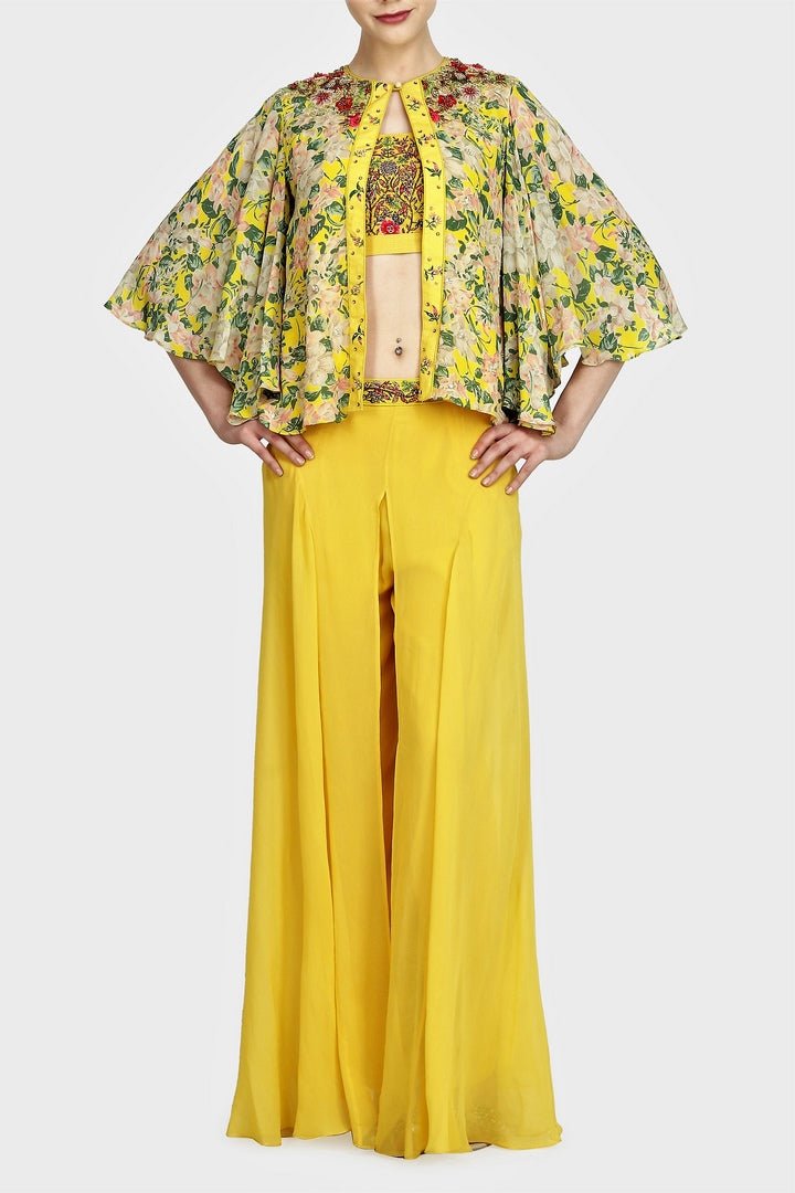Buy Indowestern yellow printed & embroidered blouse with cape and sharara online in USA. For more such gorgeous designer dresses, shop at Pure Elegance Indian fashion store in USA. A beautiful range of traditional sarees and designer clothing is available for Indian women living in USA. You can also shop at our online store.-full view