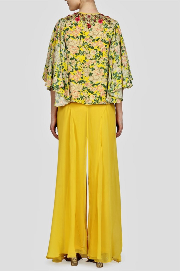 Buy Indowestern yellow printed & embroidered blouse with cape and sharara online in USA. For more such gorgeous designer dresses, shop at Pure Elegance Indian fashion store in USA. A beautiful range of traditional sarees and designer clothing is available for Indian women living in USA. You can also shop at our online store.-back