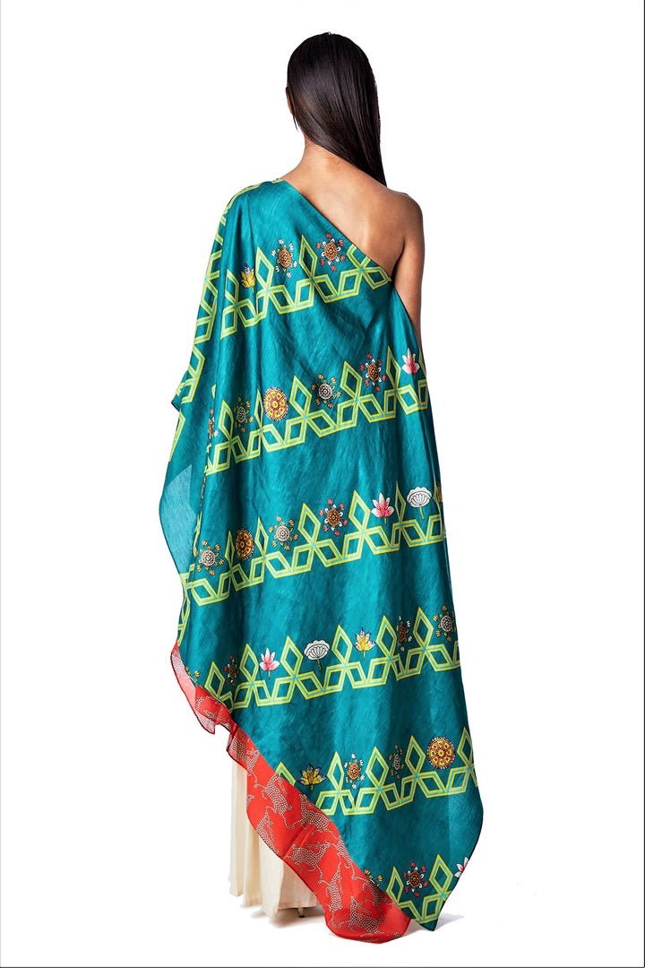 Buy dark teal diagonal printed one shoulder cape online in USA. Find a range of stunning designer dresses by Swati Vijaivargie in USA at Pure Elegance Indian clothing store. Elevate your traditional style with a range of designer sarees, Indian clothing, and much more also available at our online store.-back