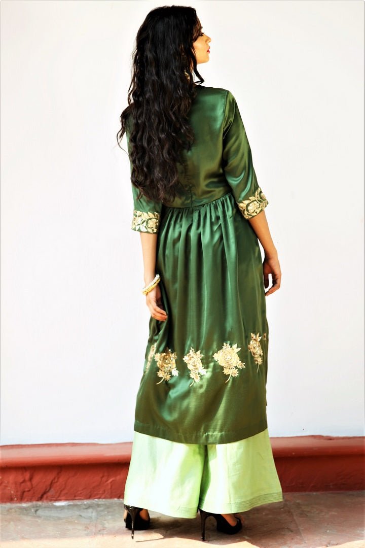 Buy seaweed green embroidered silk tunic with palazzo online in USA. Get occasion ready with a stunning range of Indian designer dresses from Pure Elegance fashion store in USA. Shop from a collection of designer suits, wedding sarees, wedding lehengas and Indian clothing for a gorgeous ethnic look from our online store.-back